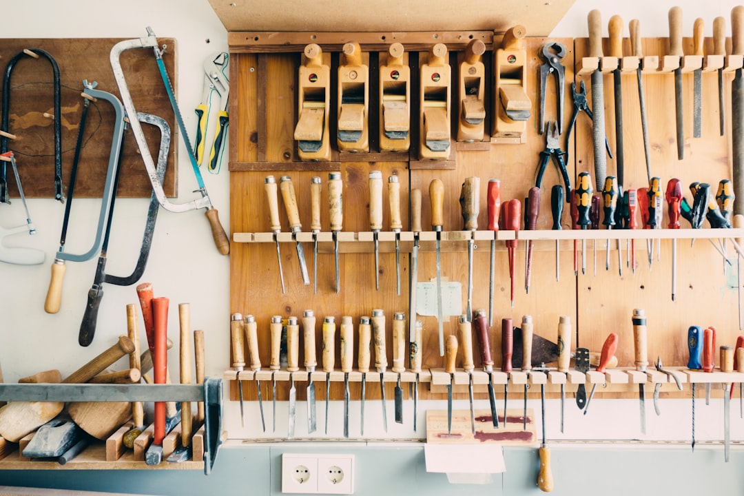 Photo by Barn Images assorted handheld tools in tool rack
